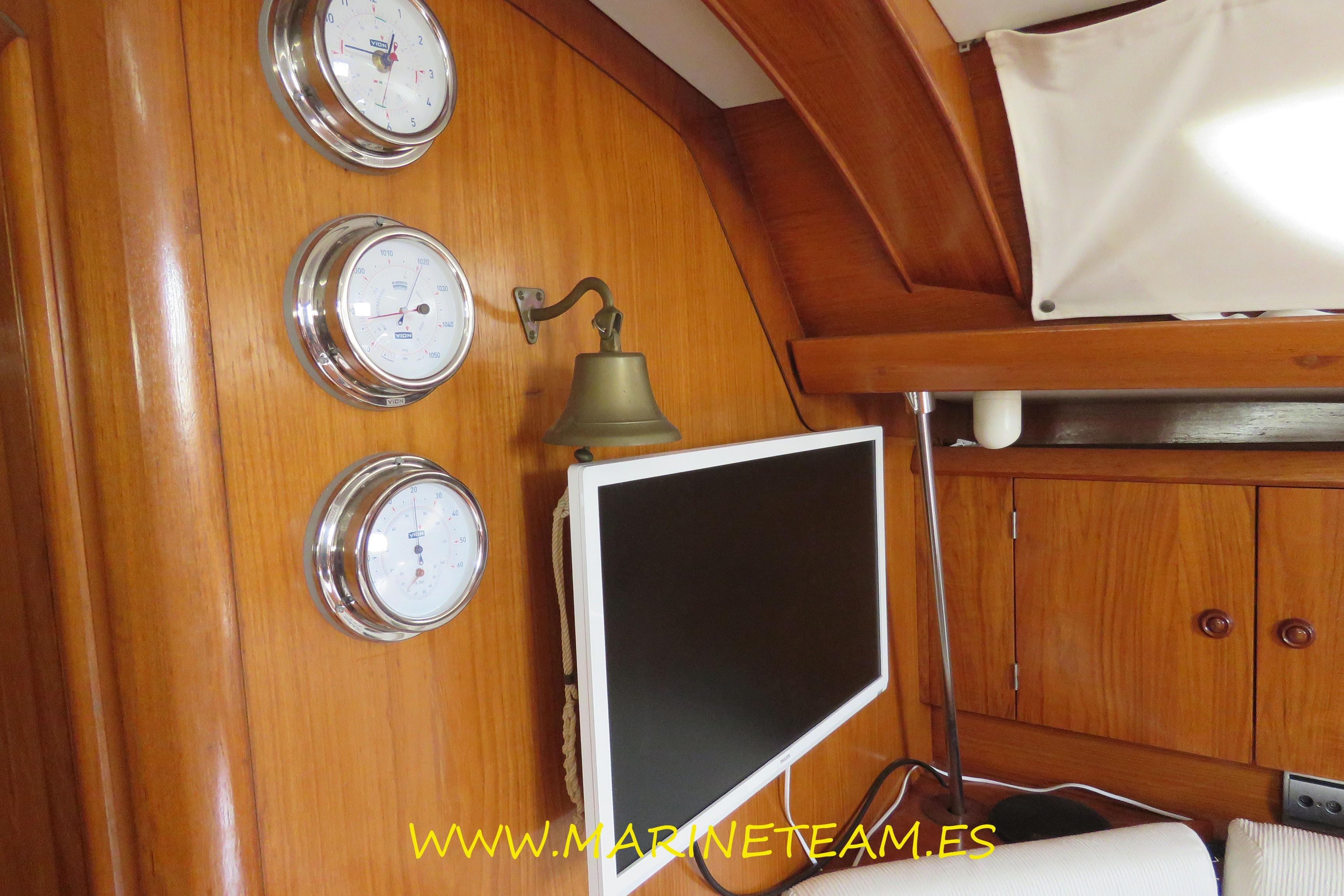 Interior of 1995 Jeanneau Sun Odyssey 45.1 yacht with instruments and monitor.