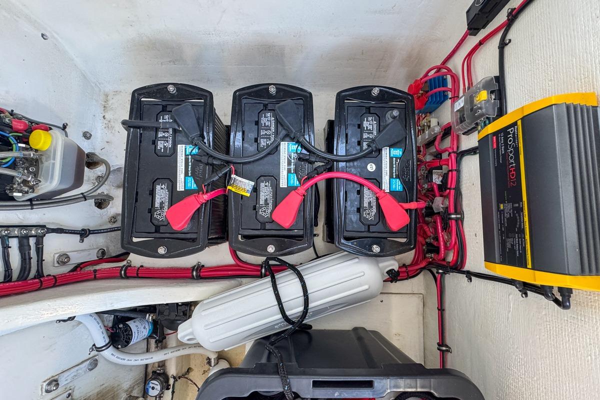 Battery compartment of 2022 Velocity 290sc boat with wiring and ProSport HD12 charger.
