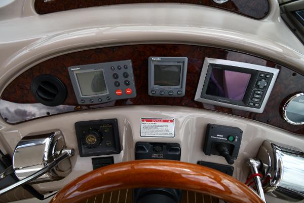 Control panel of a 2003 Sea Ray 460 Sundancer yacht with navigation instruments.