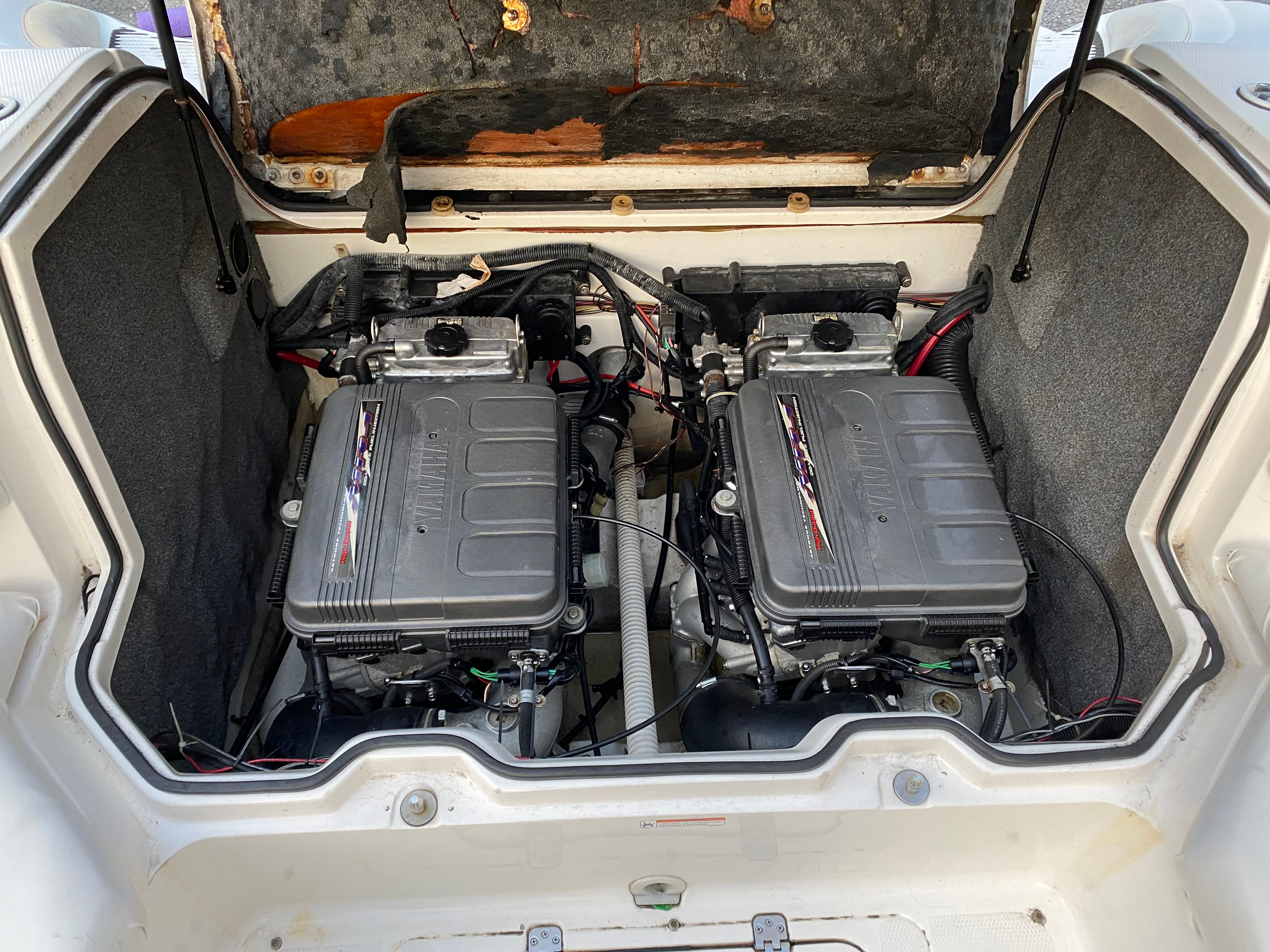 Engine compartment of a 2005 Yamaha SX230 HO boat with dual engines.