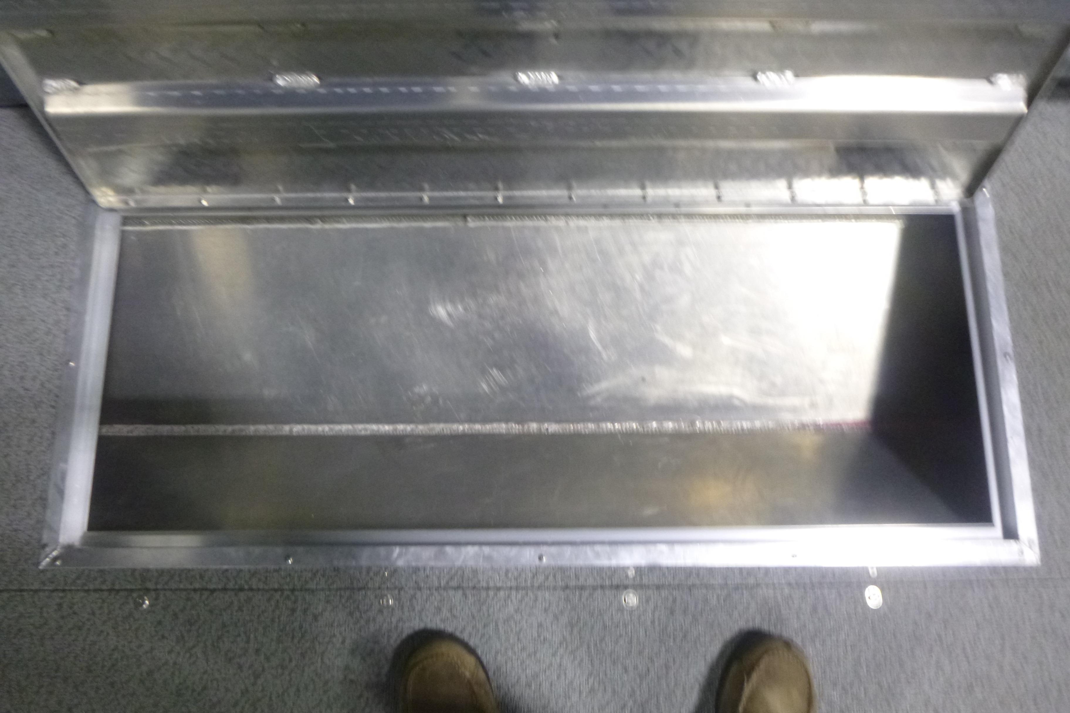 Open storage compartment in 2026 KingFisher 2425 Escape HT boat.
