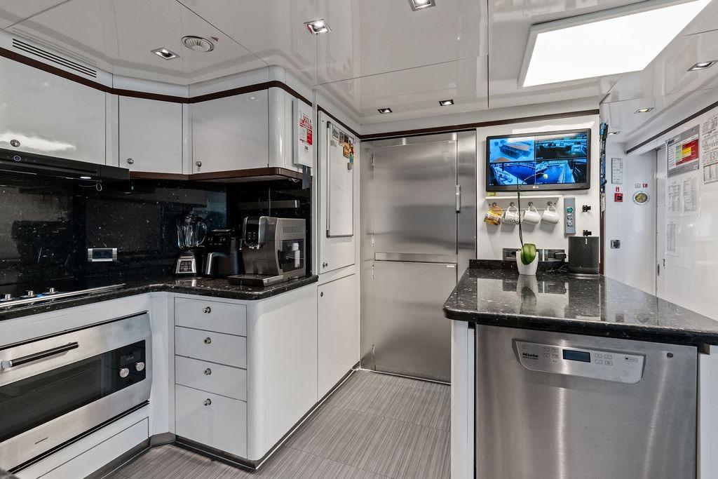 Luxurious kitchen interior on a 2008 Benetti Classic yacht, featuring modern appliances and sleek design.