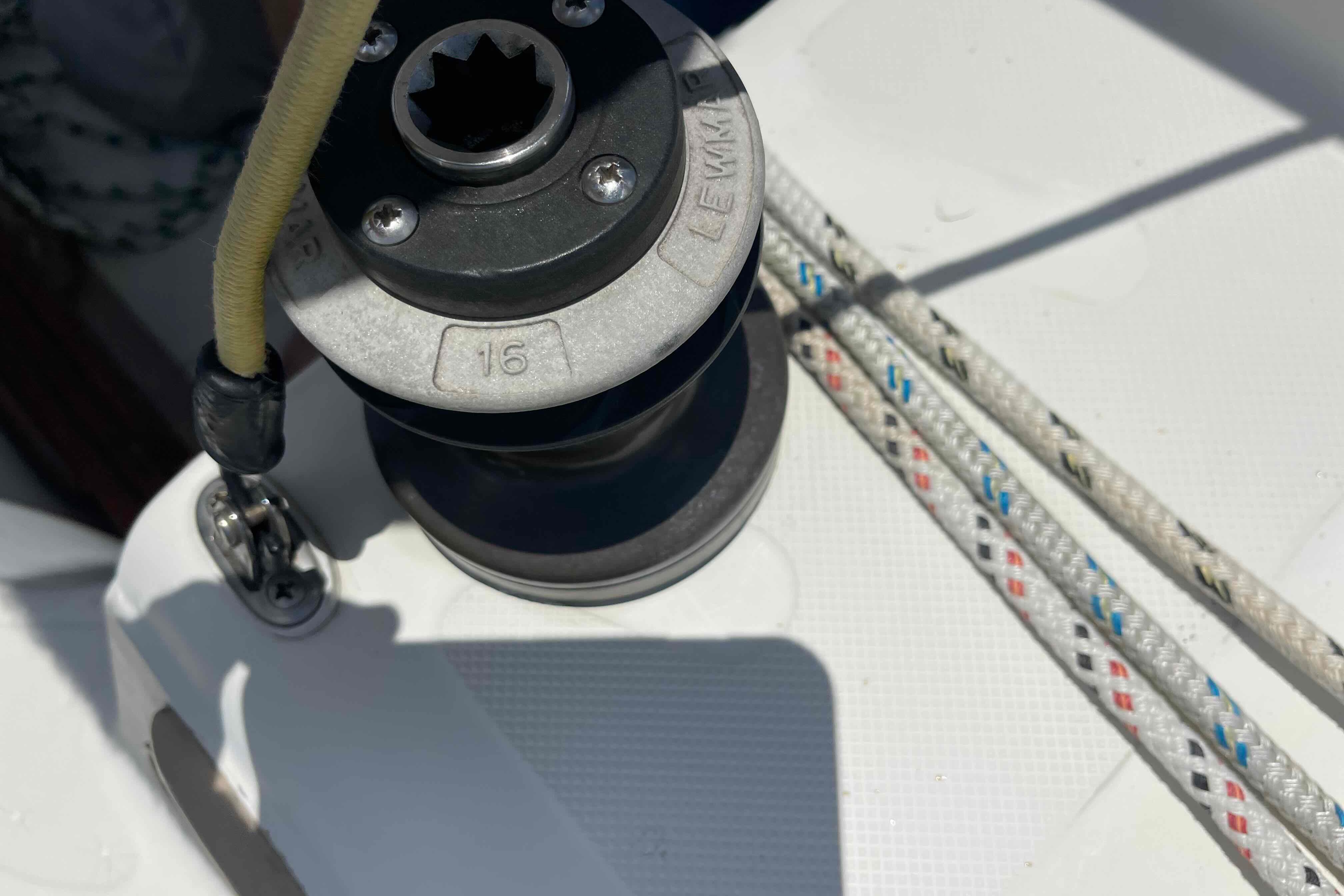 Winch and ropes on a 1987 Pacific Seacraft 34 sailboat deck.
