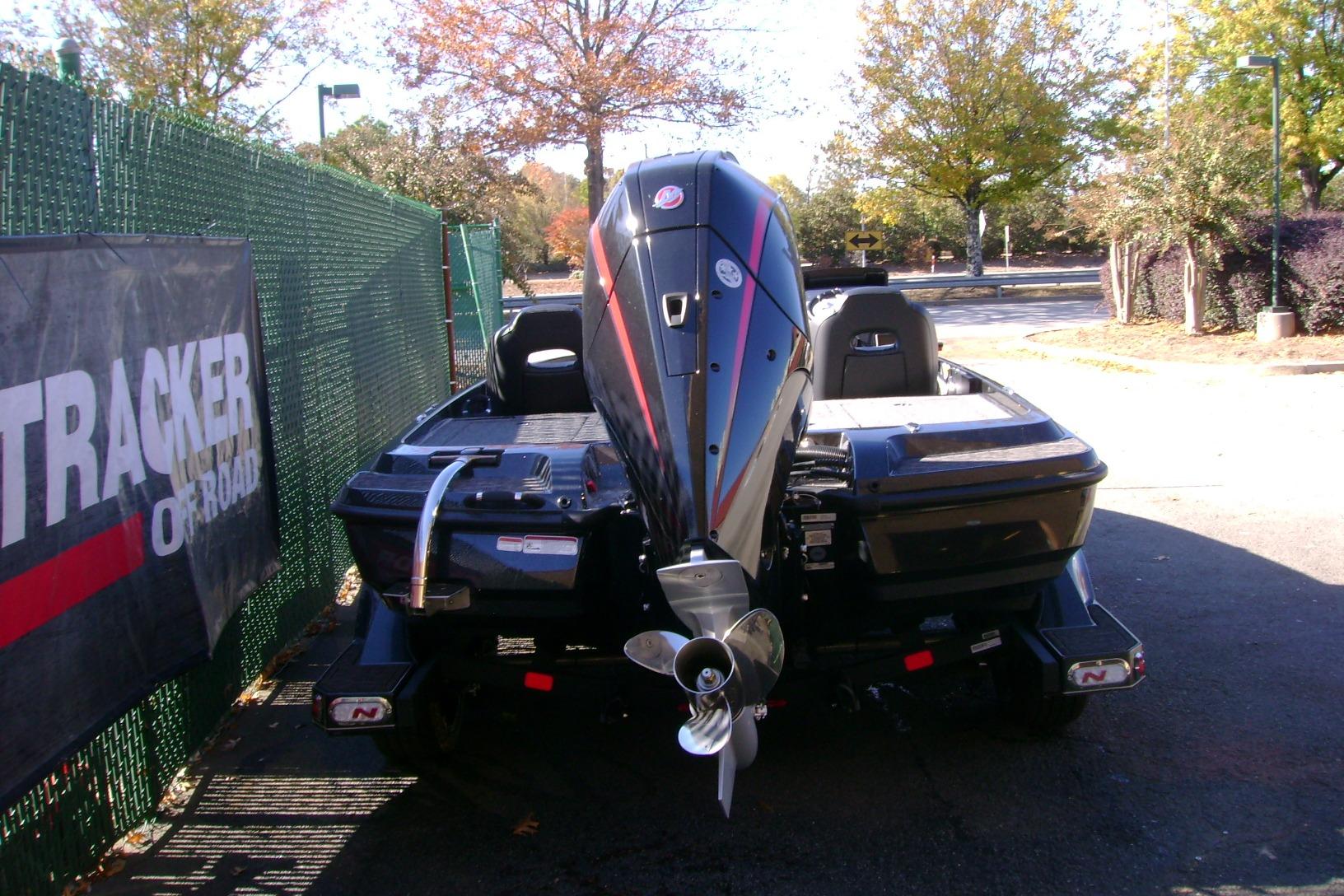 2026 Nitro Z21 XL Pro boat with powerful outboard motor, parked outdoors.