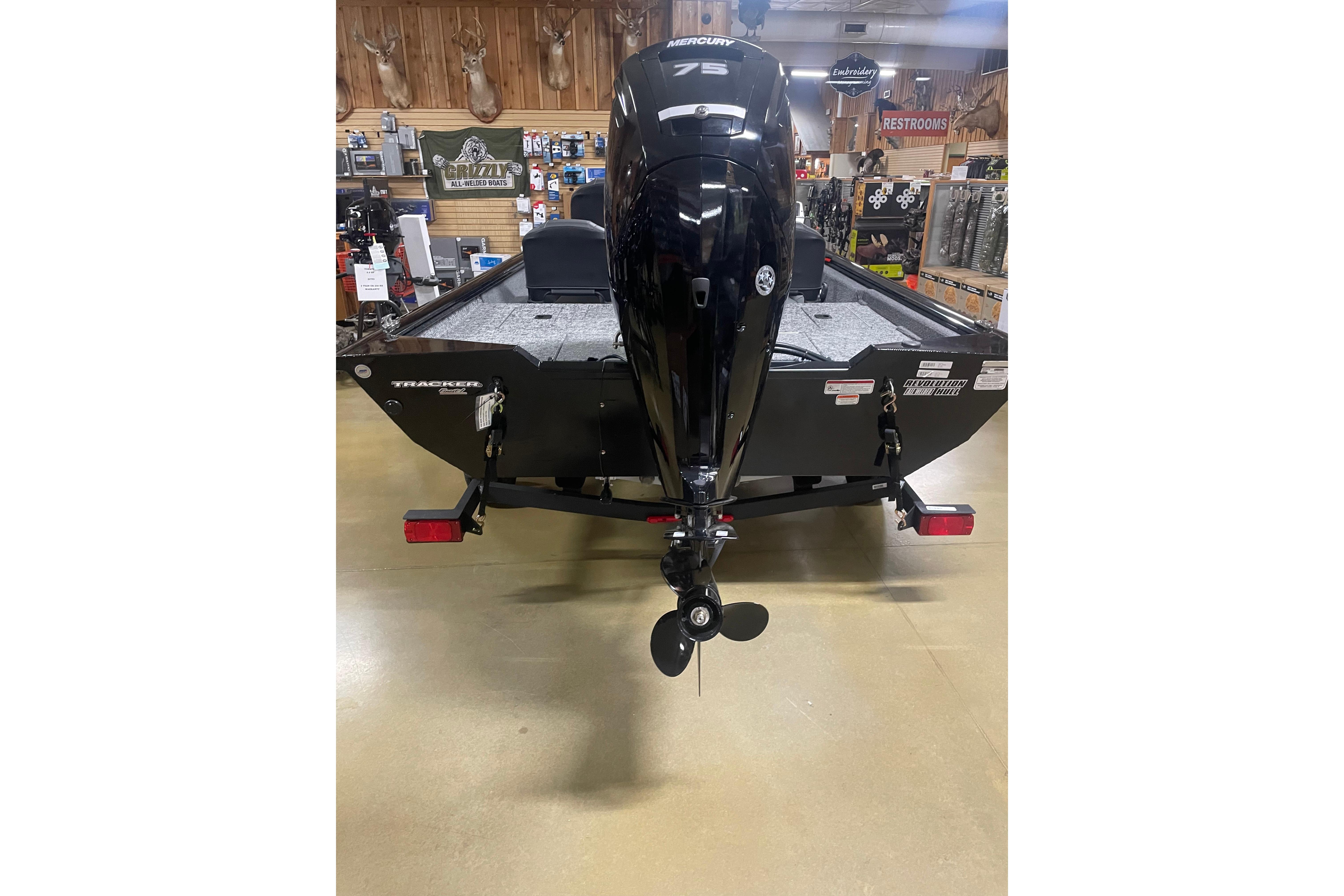 2026 Tracker Pro Team 175 Crappie Edition boat with Mercury 75 engine in showroom.
