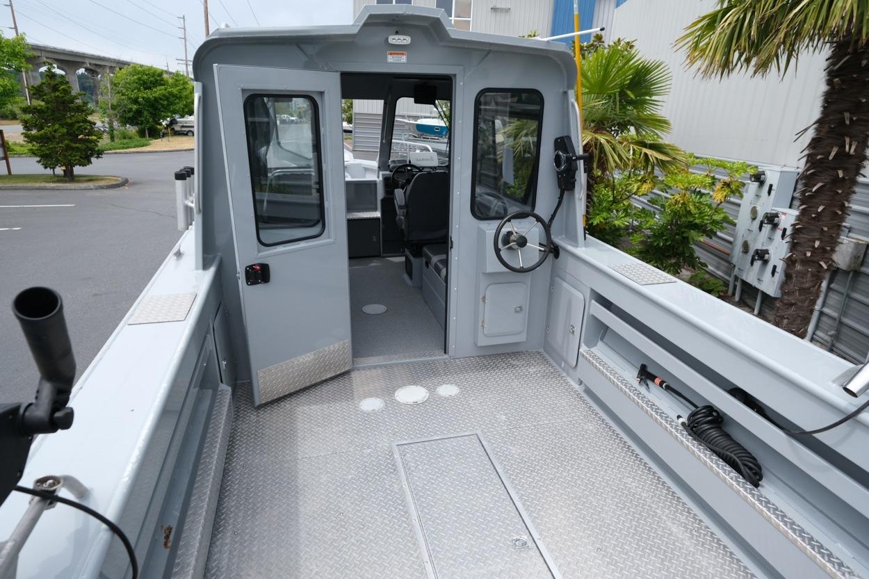 2021 Hewescraft 240 Ocean Pro ET Hardtop boat interior with open cabin door.