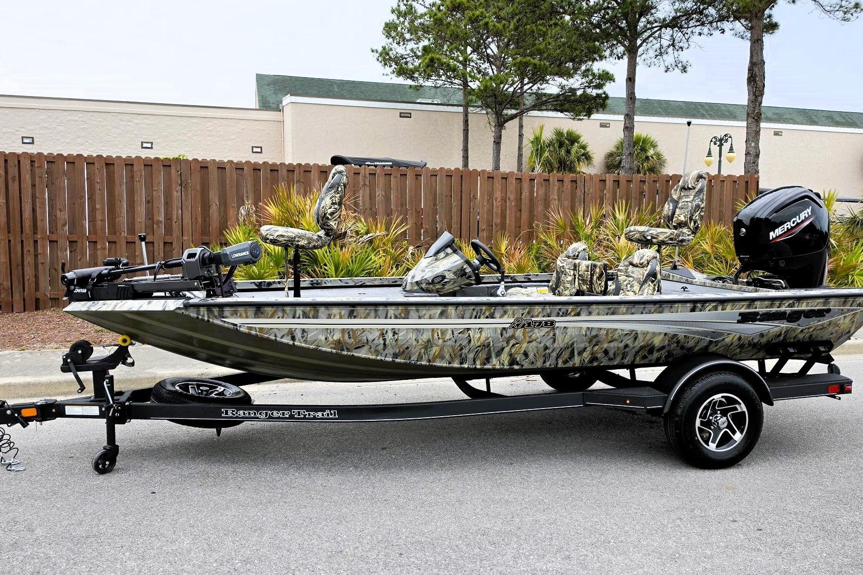 2026 Ranger RT178 fishing boat with camouflage design on a trailer.