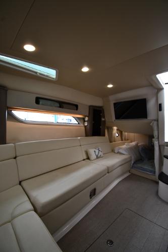 Luxurious interior of 2021 Regal 35 Sport Coupe with beige seating and modern lighting.
