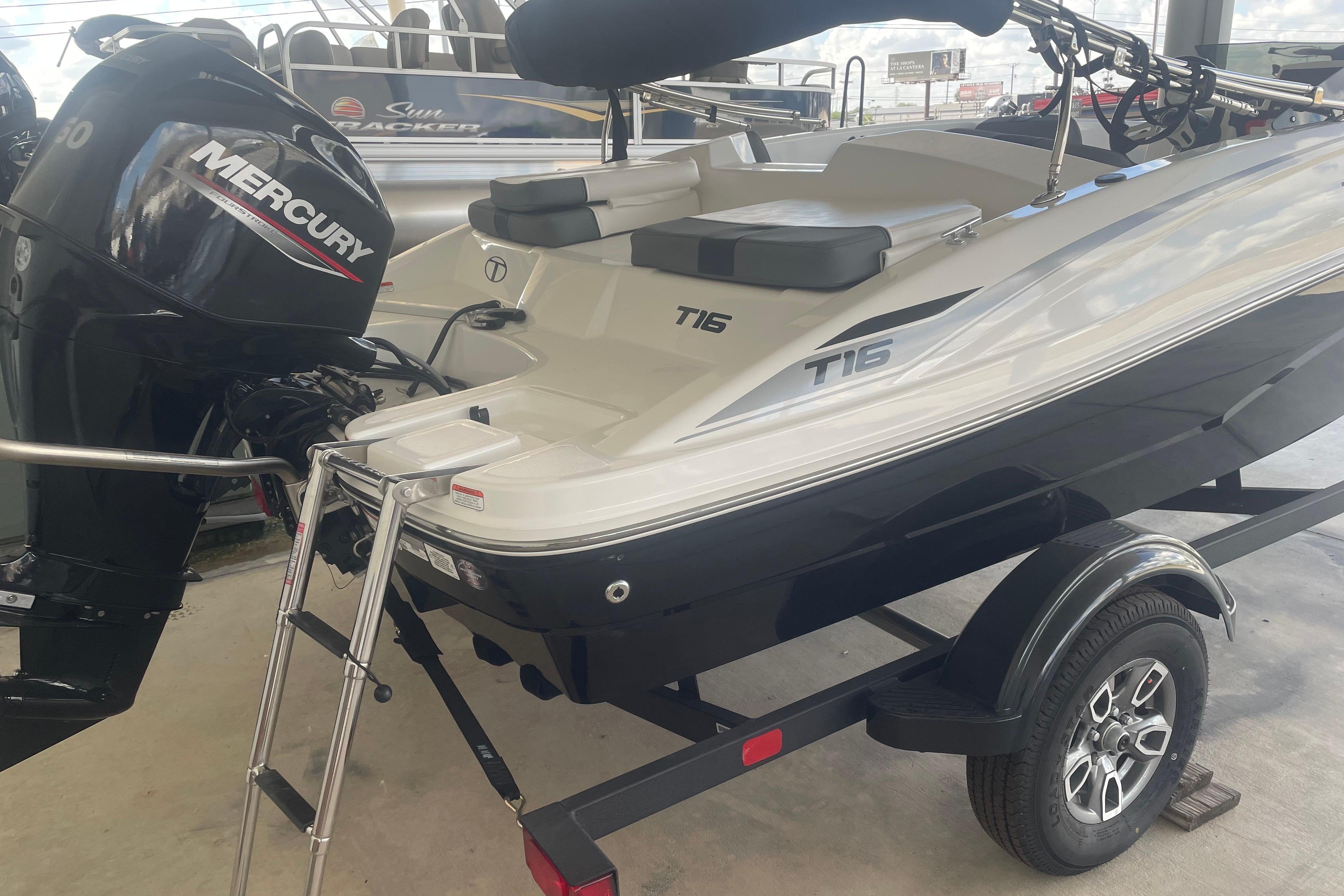 2026 Tahoe T16 boat with Mercury engine on trailer, featuring sleek design and modern features.