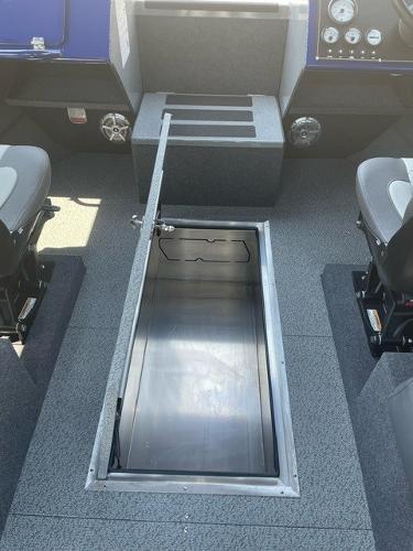 2025 Spartan 240 Maximus Pro boat interior with open storage compartment.