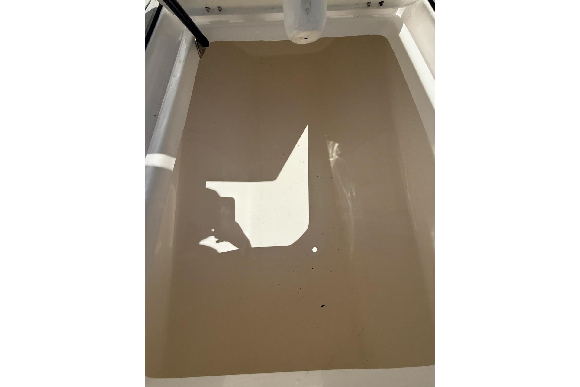 2021 Custom Infusion 34 CC boat interior with water pooling on the deck.