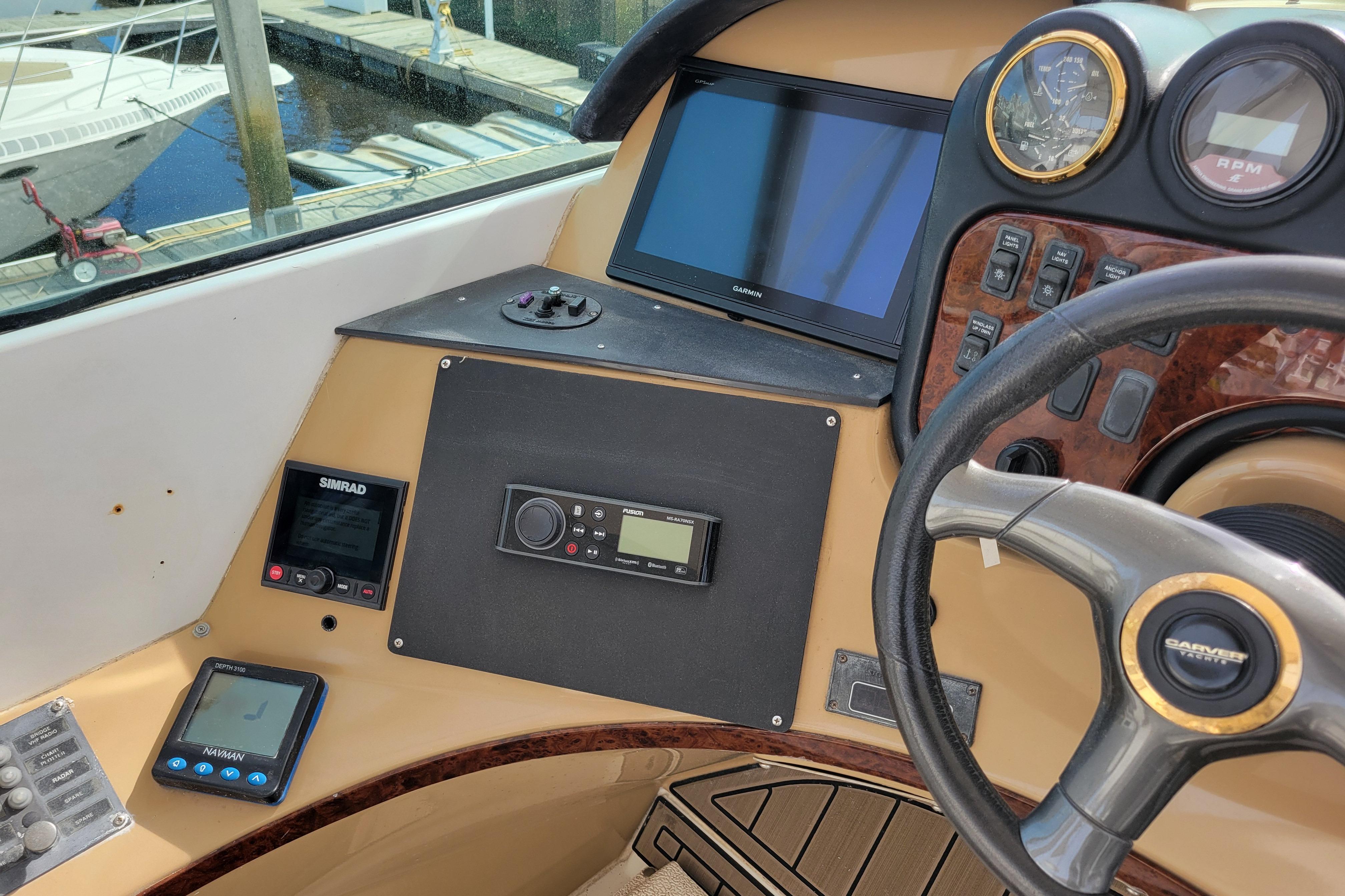 2001 Carver 570 Voyager Pilothouse helm with navigation and control instruments.