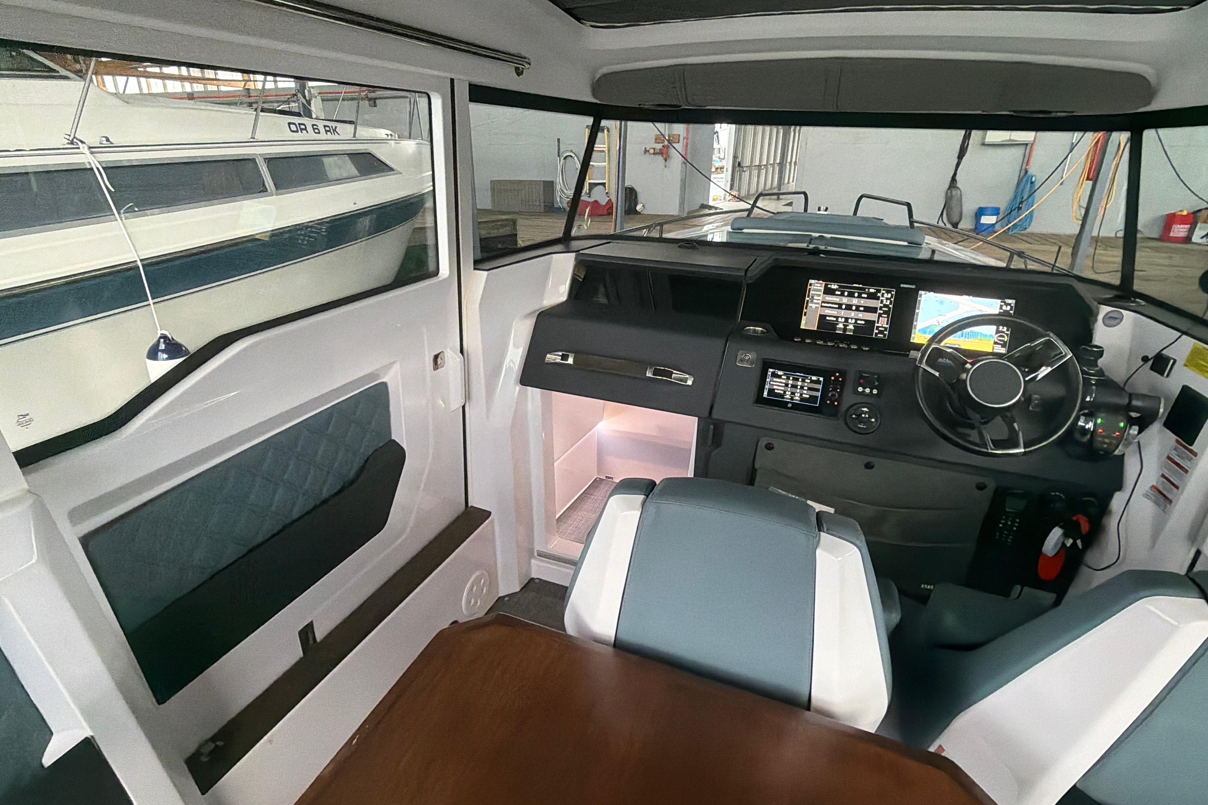 Interior of 2022 Axopar Brabus 37 XC Cross Cabin with modern dashboard and seating.