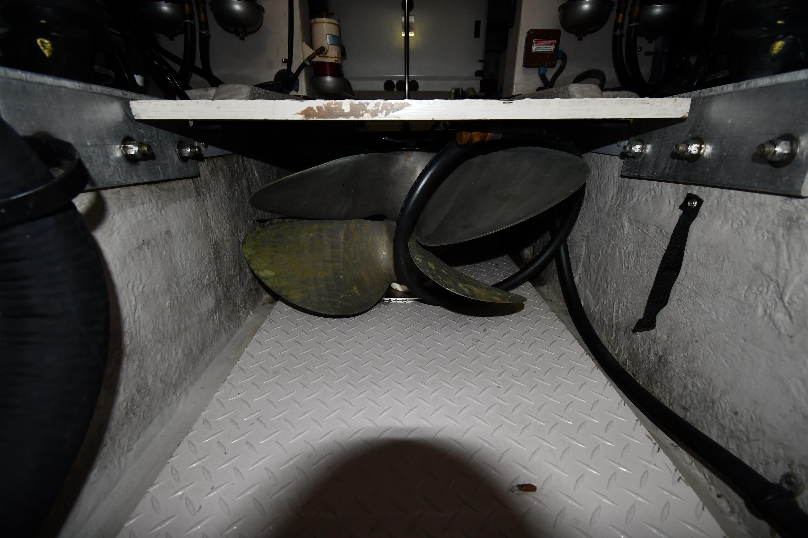 Engine room of 2001 Sea Ray 540 Sundancer with visible propeller and mechanical components.