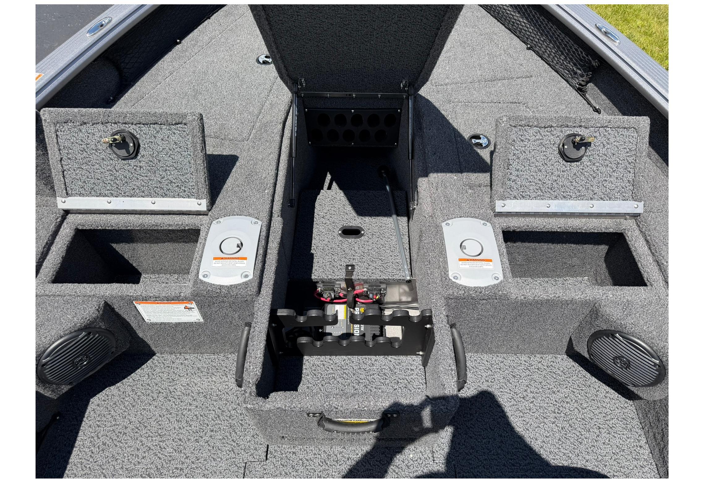 2027 Lund 1875 Pro Guide boat interior with storage compartments and speaker system.