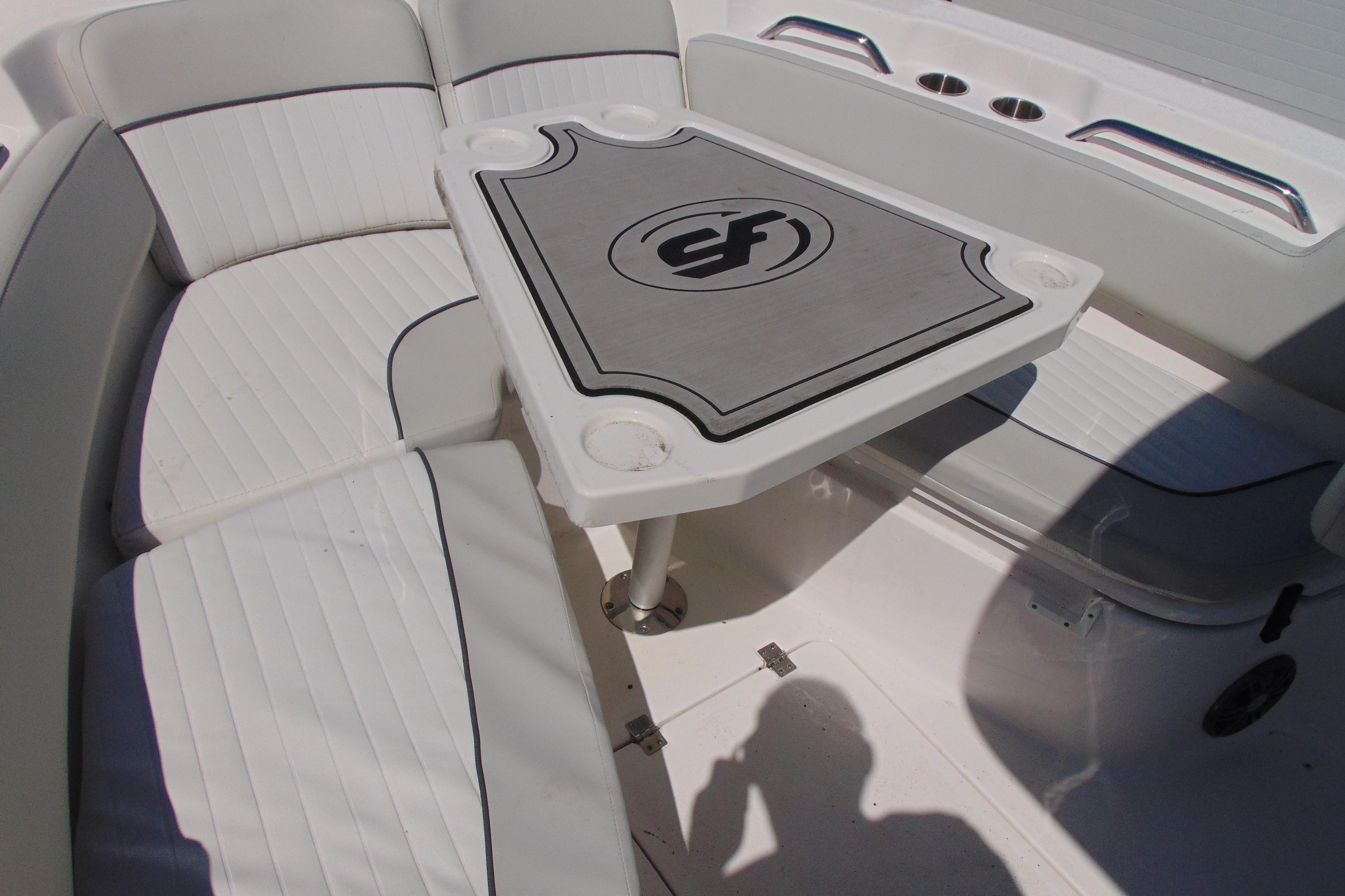 Interior seating and table of 2022 Sea Fox 248 Commander boat.