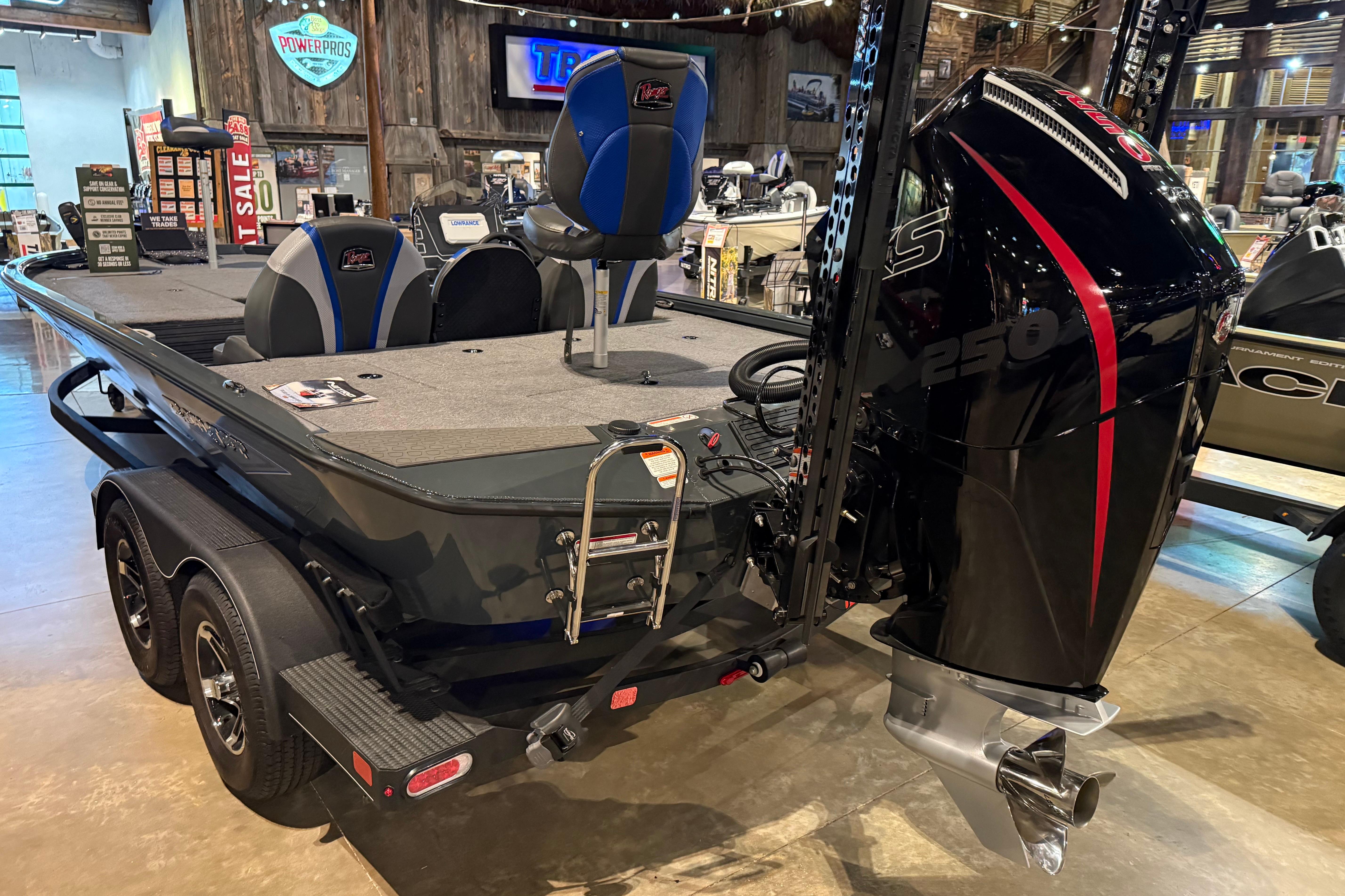 2025 Ranger ALPHA 208 boat with powerful 250 HP engine, displayed indoors.