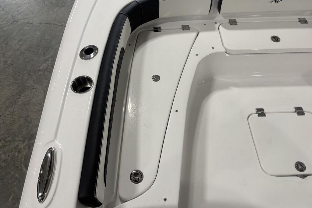 2026 Tidewater 2300 Carolina Bay boat interior with storage compartments and cup holders.
