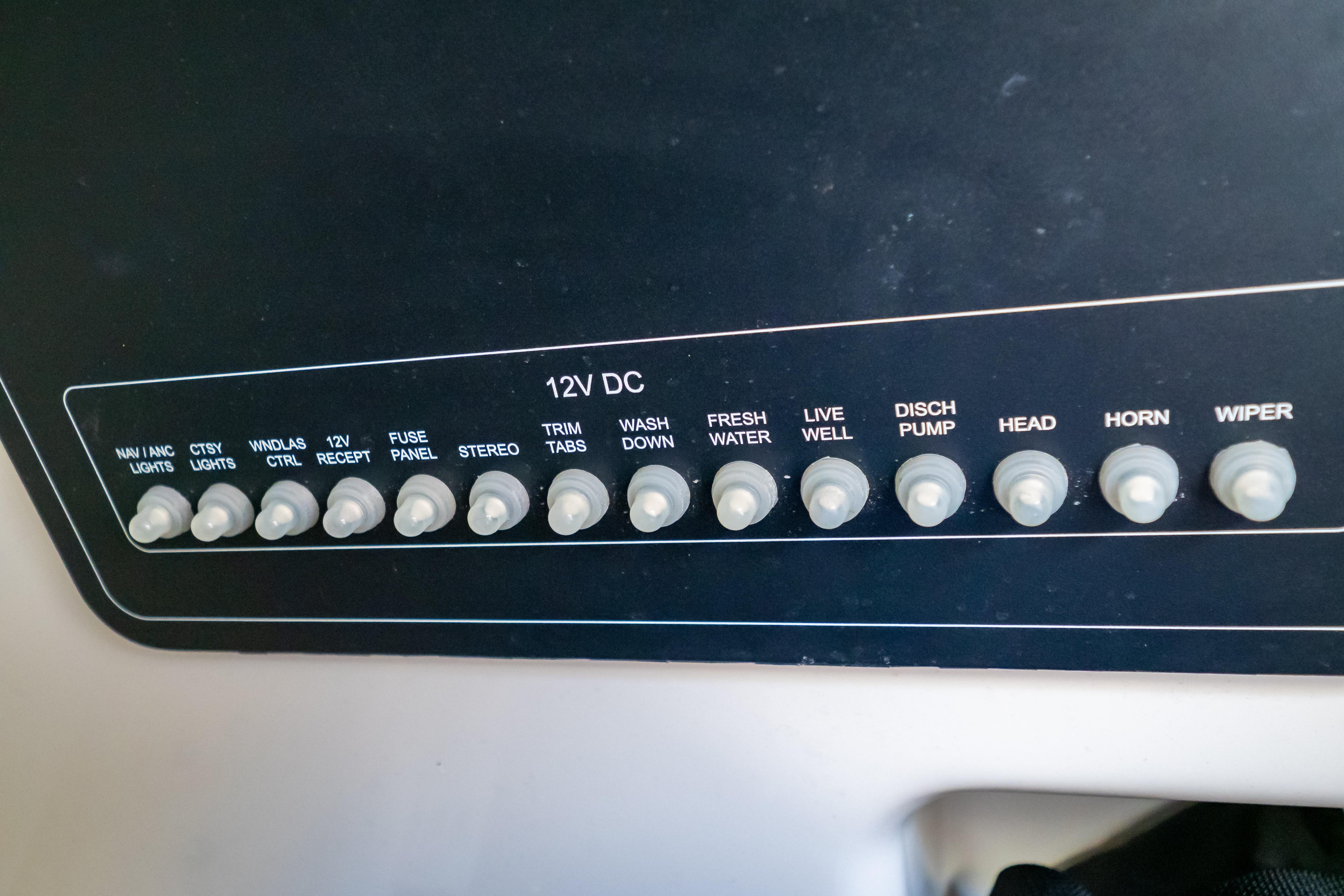 Control panel of a 2019 Boston Whaler 270 Vantage boat with labeled switches.