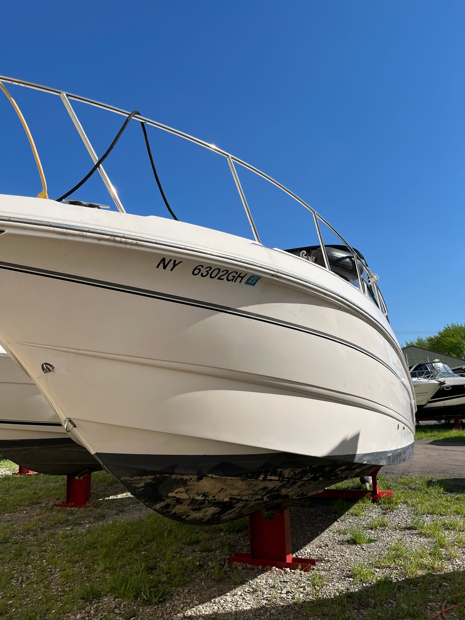 Chaparral Signature 2000 boat on stands, blue sky.