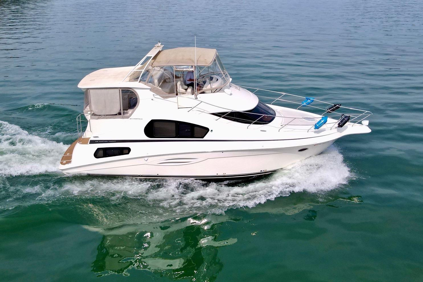2004 Silverton 39 Motor Yacht cruising on calm blue waters.