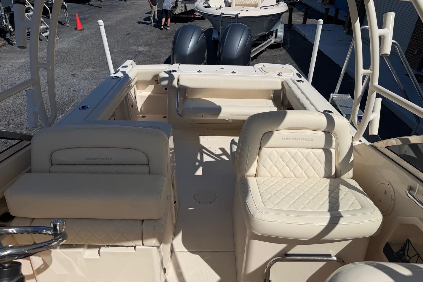 2022 Grady-White Freedom 275 boat interior with cream seating and dual engines.