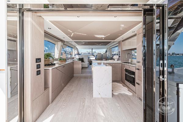 Luxurious interior of 2025 Sunseeker Manhattan 68 yacht with modern kitchen design.