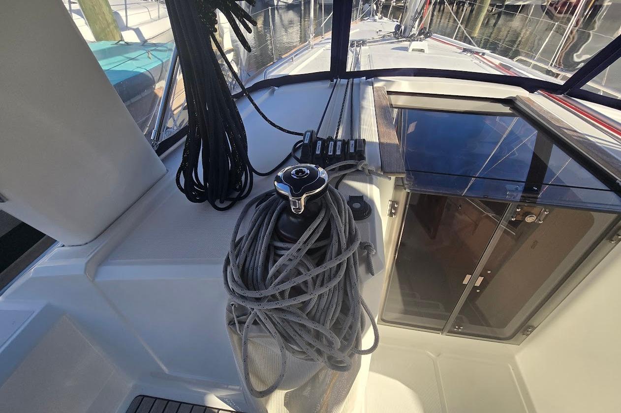 2023 Beneteau Oceanis 38.1 sailboat cockpit with ropes and winch.