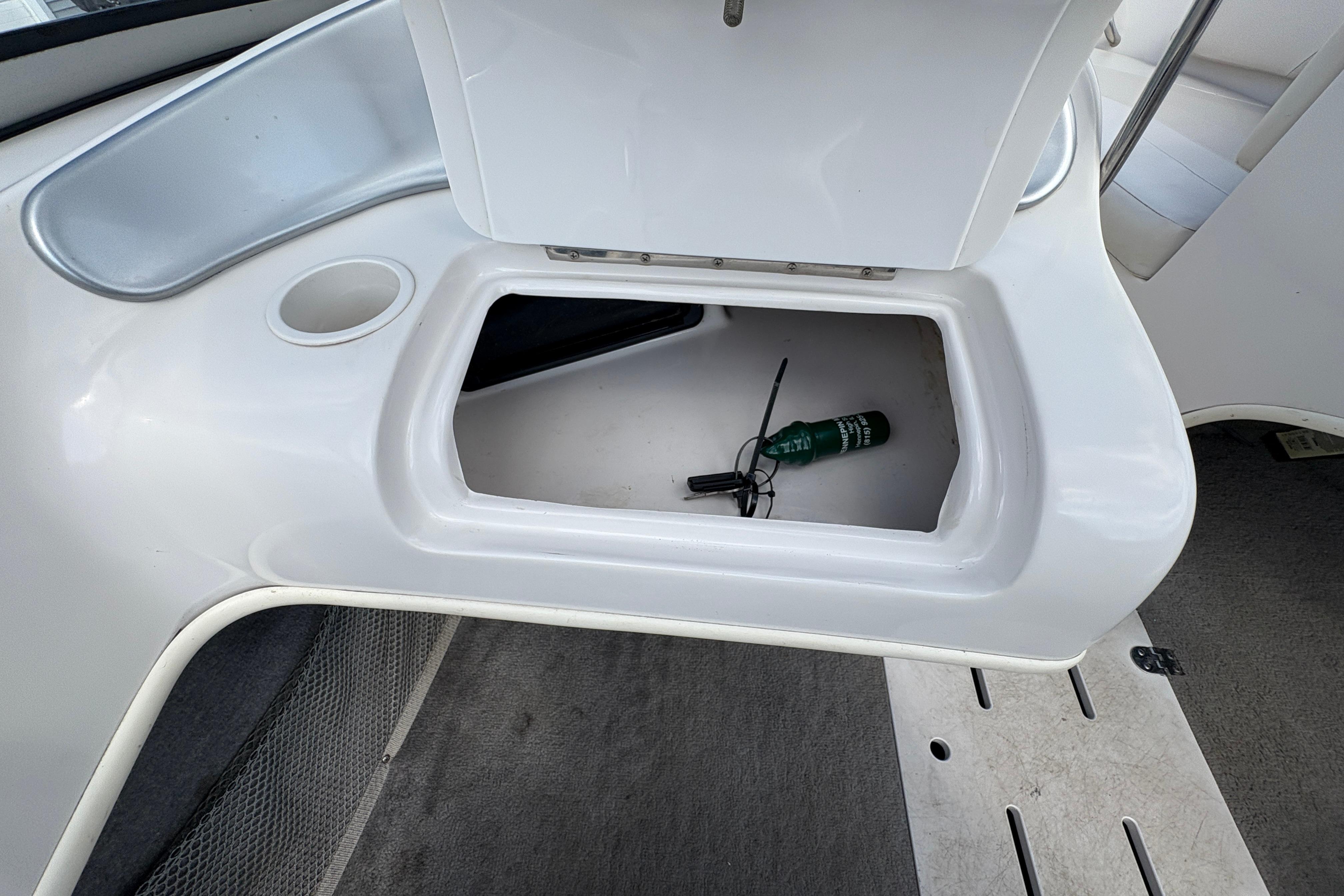 Open storage compartment in 2005 Starcraft C-Star 1700 OB boat interior.