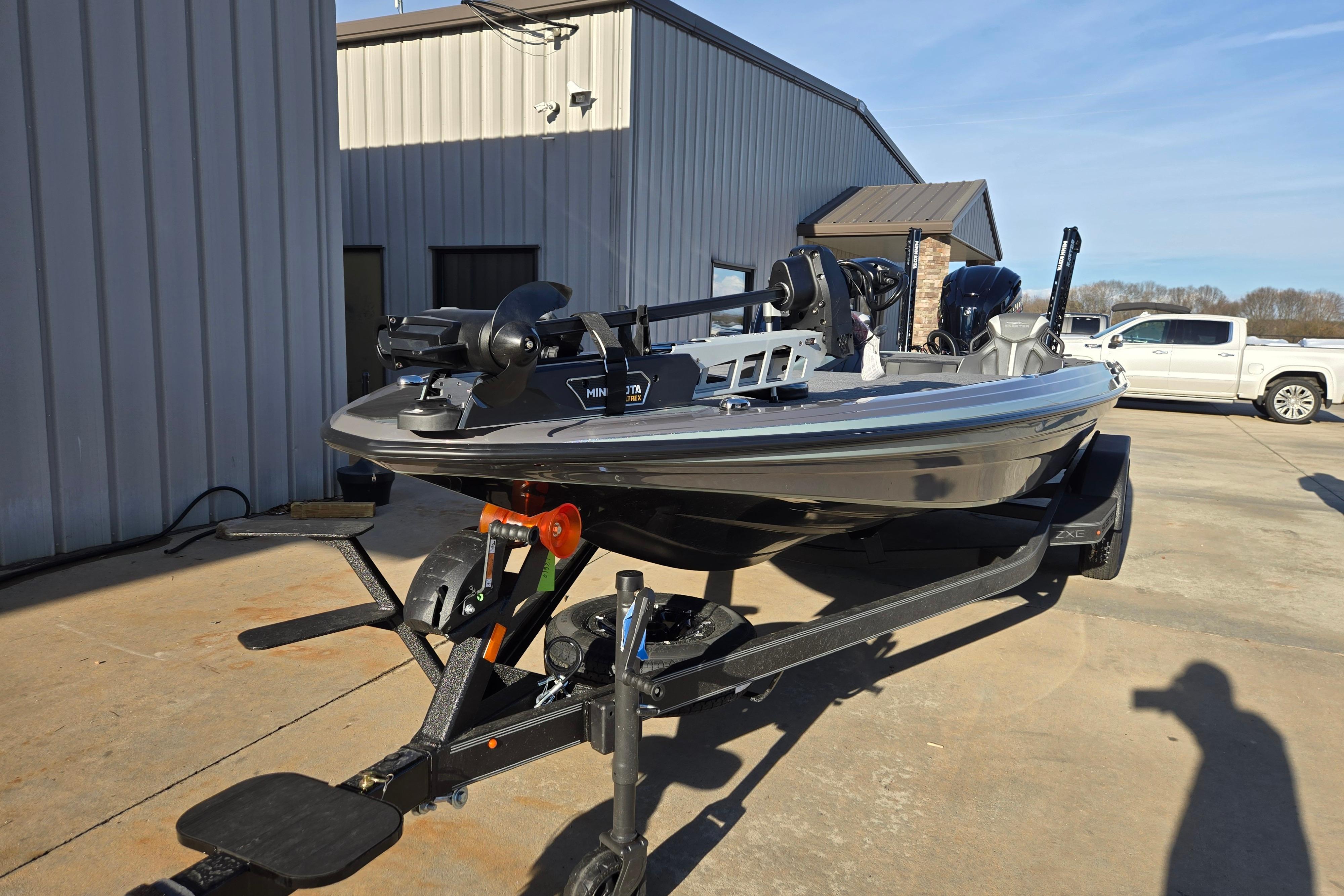2026 Skeeter ZXE21 fishing boat on trailer outside a building.