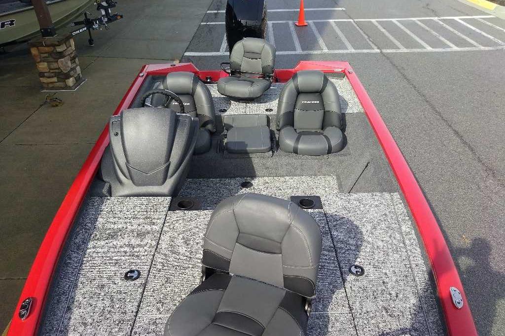2026 Tracker Pro Team 195 boat interior with gray seating and red accents.