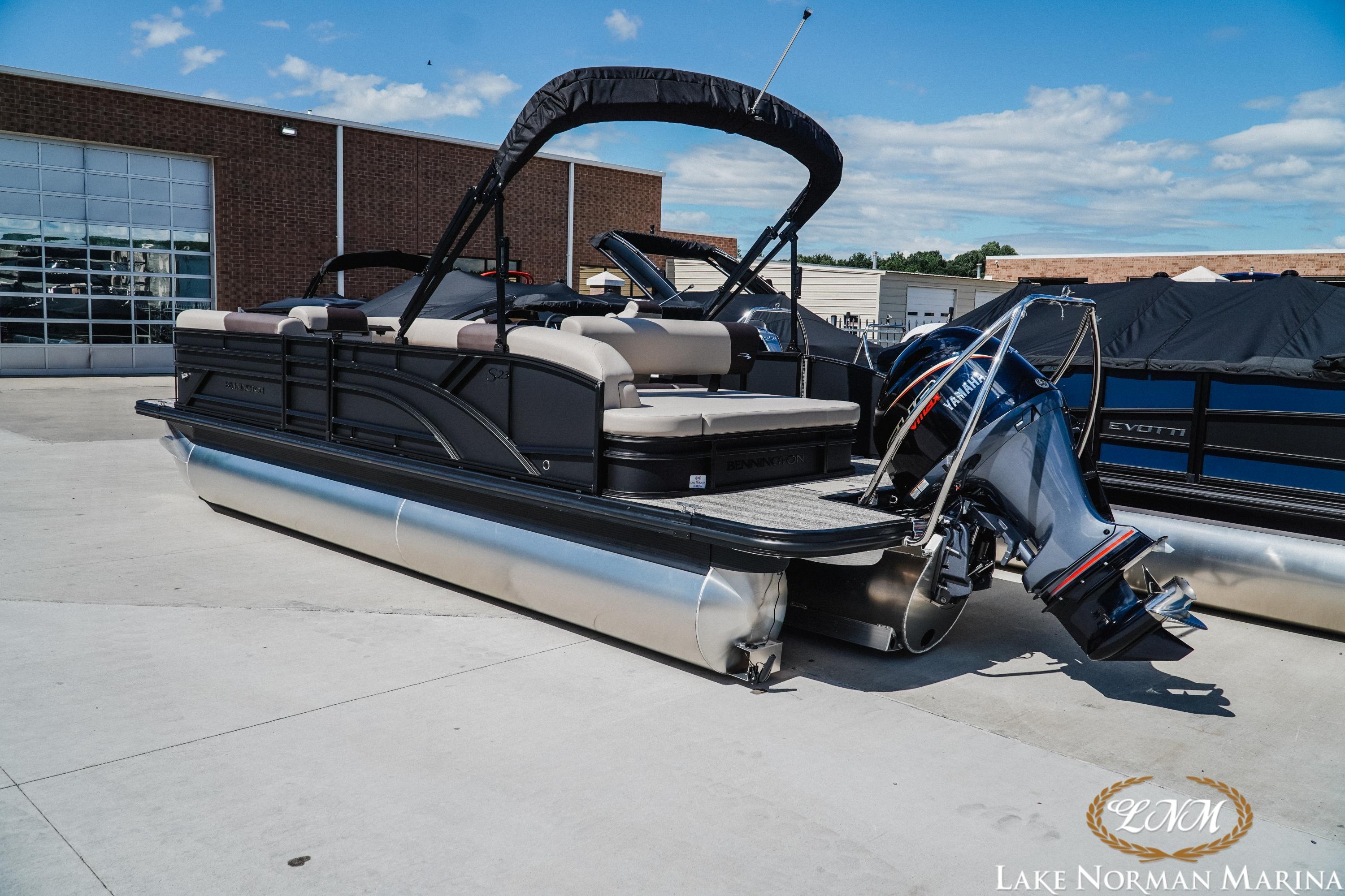 2027 Bennington 23ssb pontoon boat at Lake Norman Marina, featuring Yamaha outboard motor.