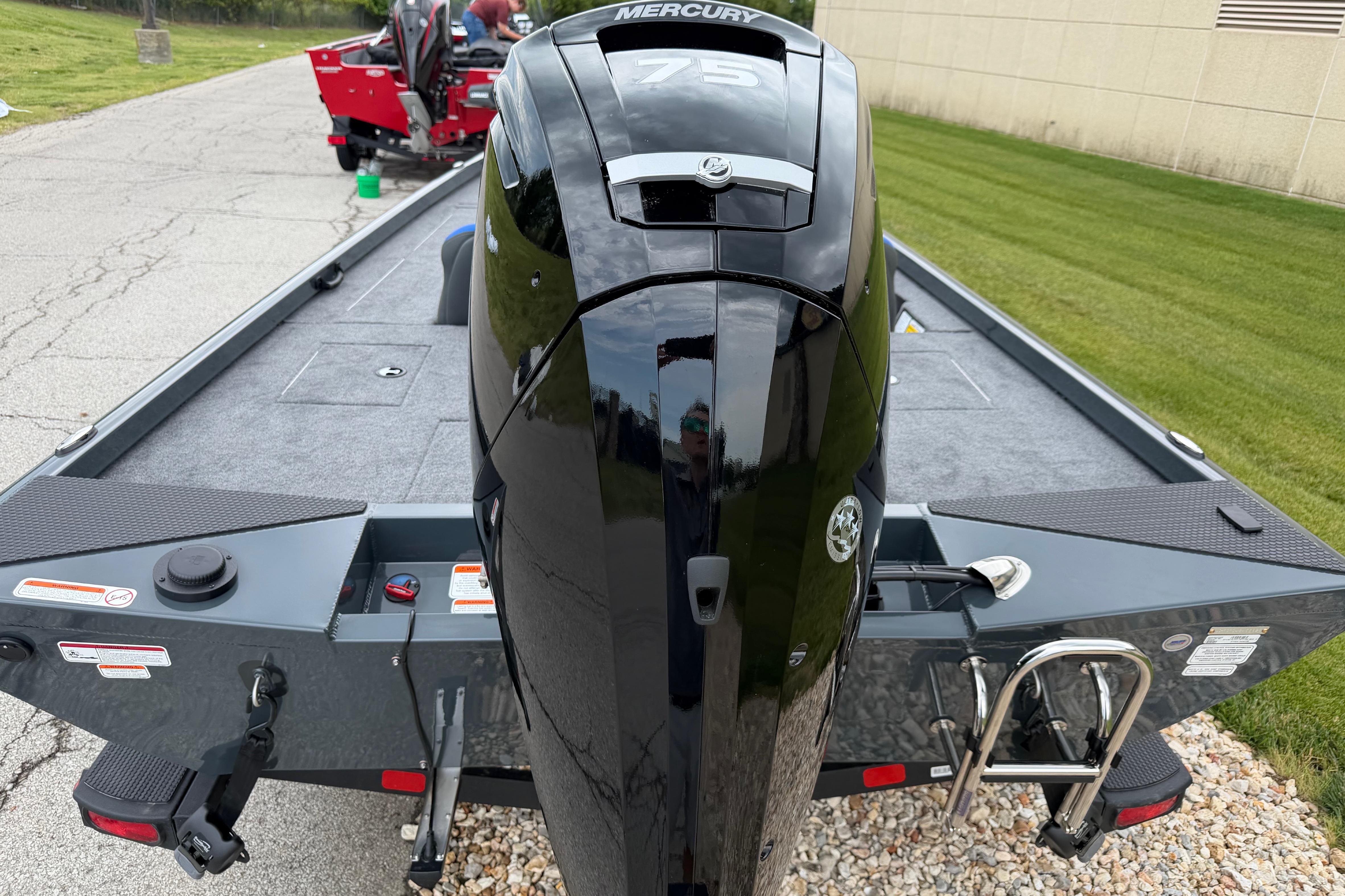 2026 Ranger RT178C boat with Mercury 75 engine, parked on a paved area.