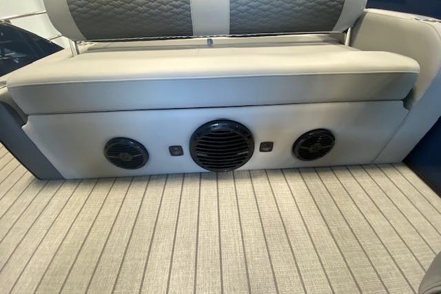 Bentley Pontoons Elite 223 Swingback 2026 interior with speaker system and cushioned seating.