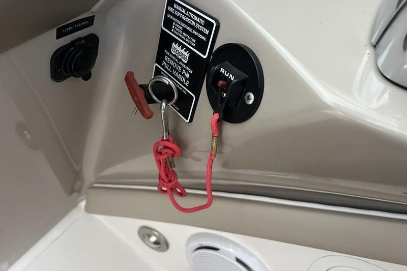 Control panel of a 2011 Sea Ray 300 SLX boat with ignition keys.