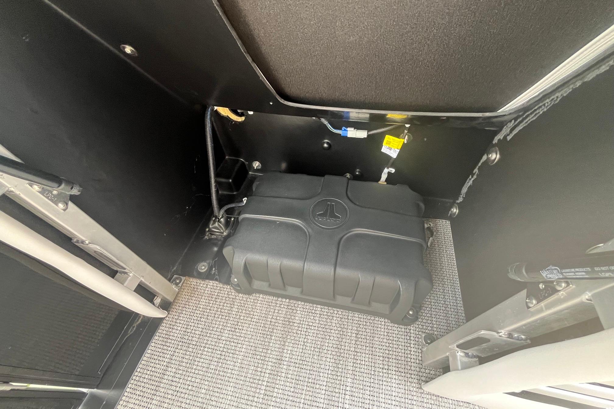 2024 Harris Grand Mariner 250 interior showing a secured black storage compartment.