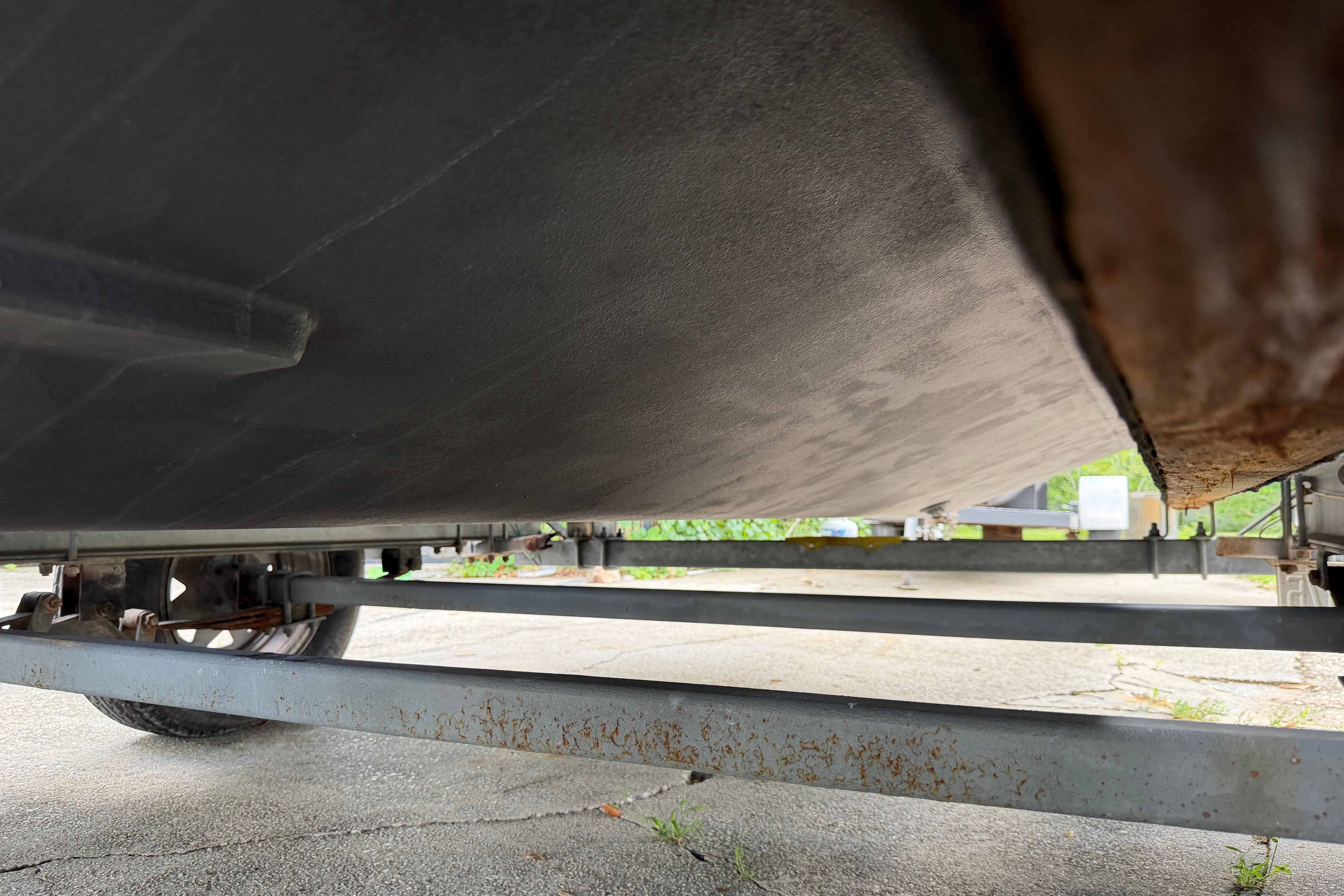 Underneath view of a 1987 Grady-White Seafarer 226 boat on a trailer.