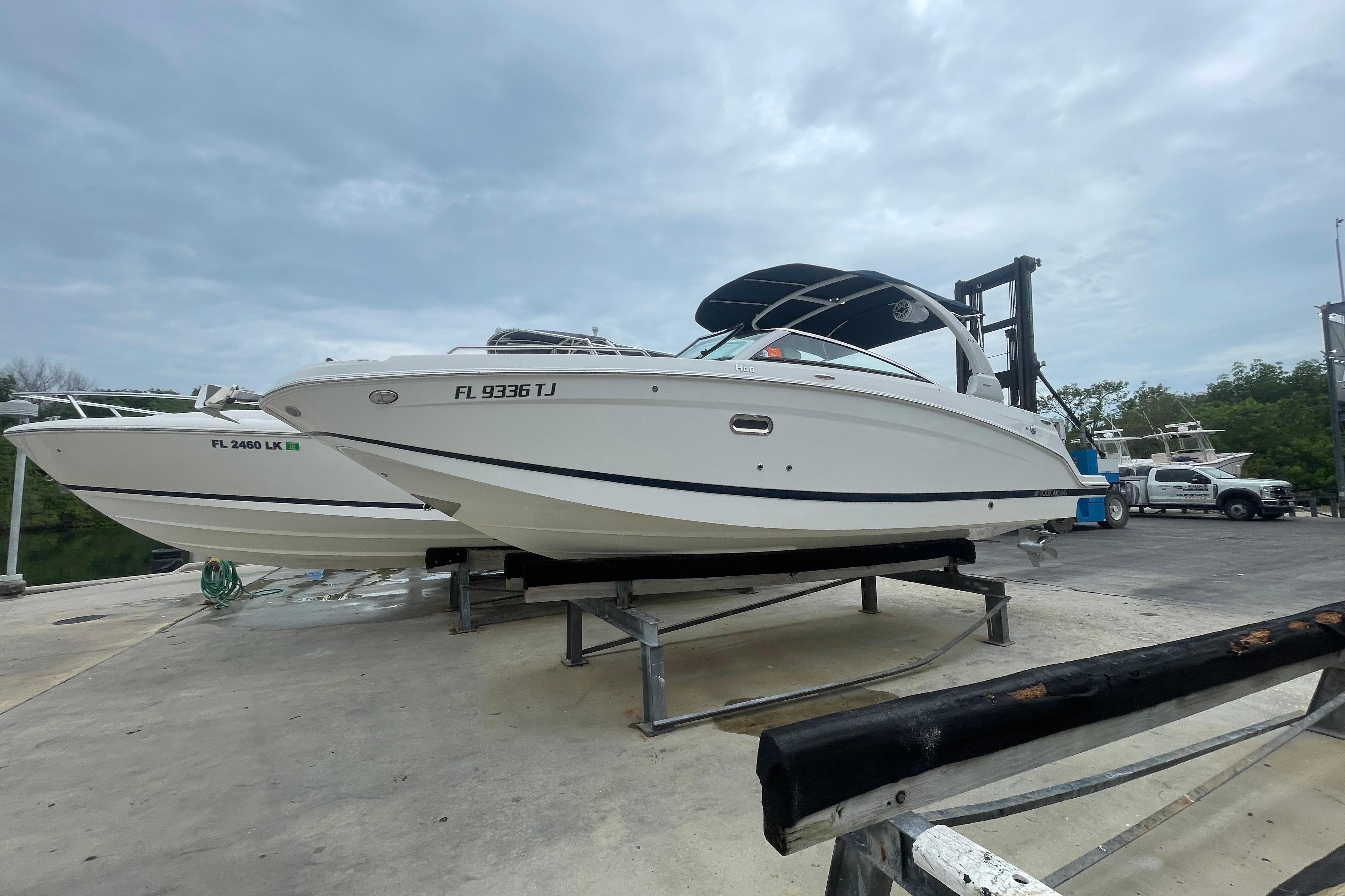 2022 Four Winns HD8 OB boat on a dock, ready for launch.