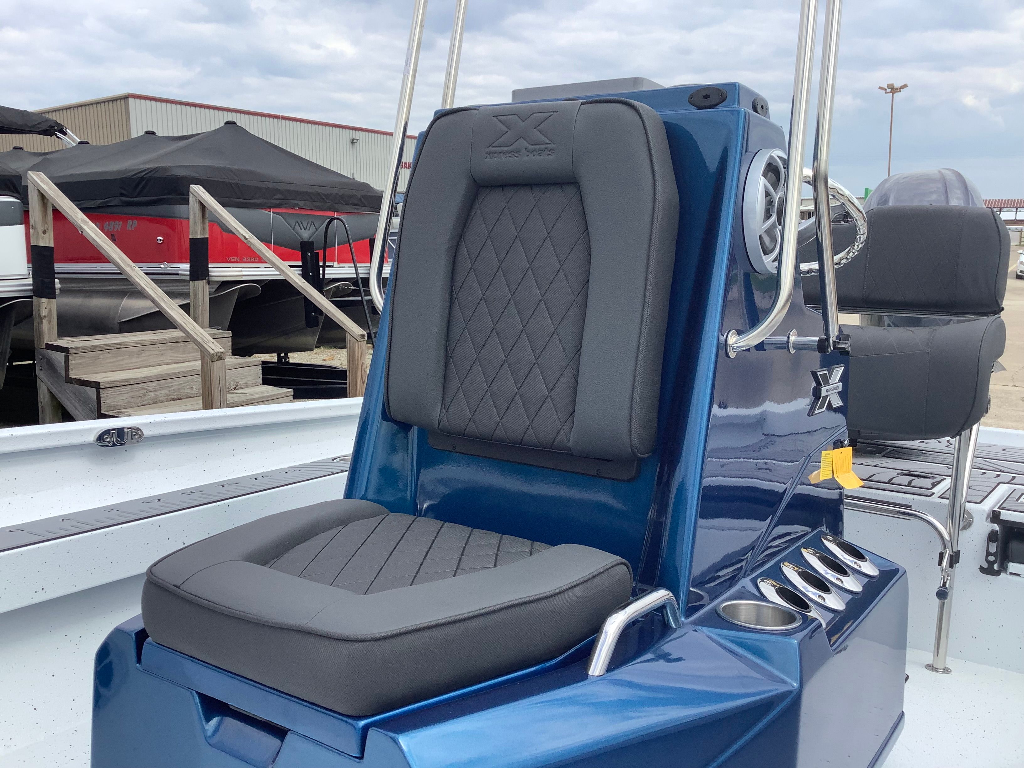 2026 Xpress H22B Bay boat with cushioned seat.