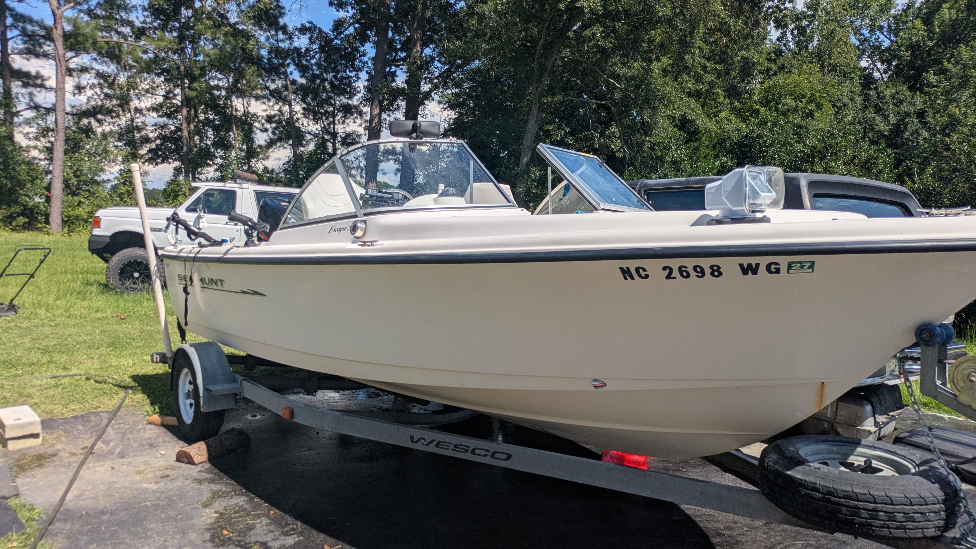 Sea Hunt Escape 200 boat on trailer, year 2000.