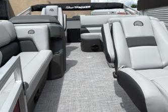 2026 Sun Tracker SportFish 20 DLX pontoon boat interior with gray seating and carpet.