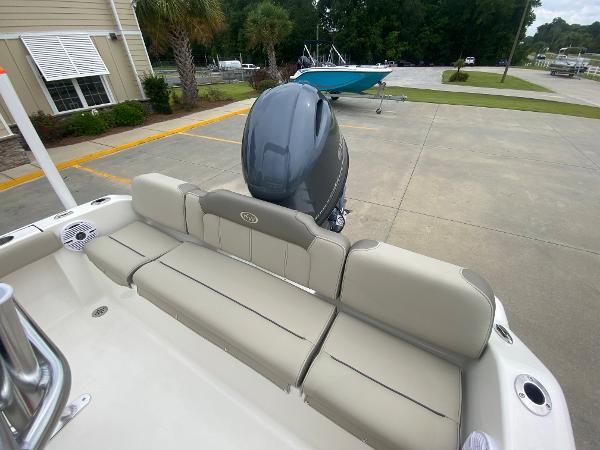 2024 Key West 189 FS boat with rear seating and outboard motor.
