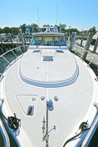 2008 Tiara Yachts 4200 Open docked, showcasing spacious deck and sleek design.