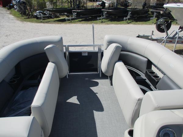2025 Starcraft LX16R pontoon boat interior with plush seating and cup holders.