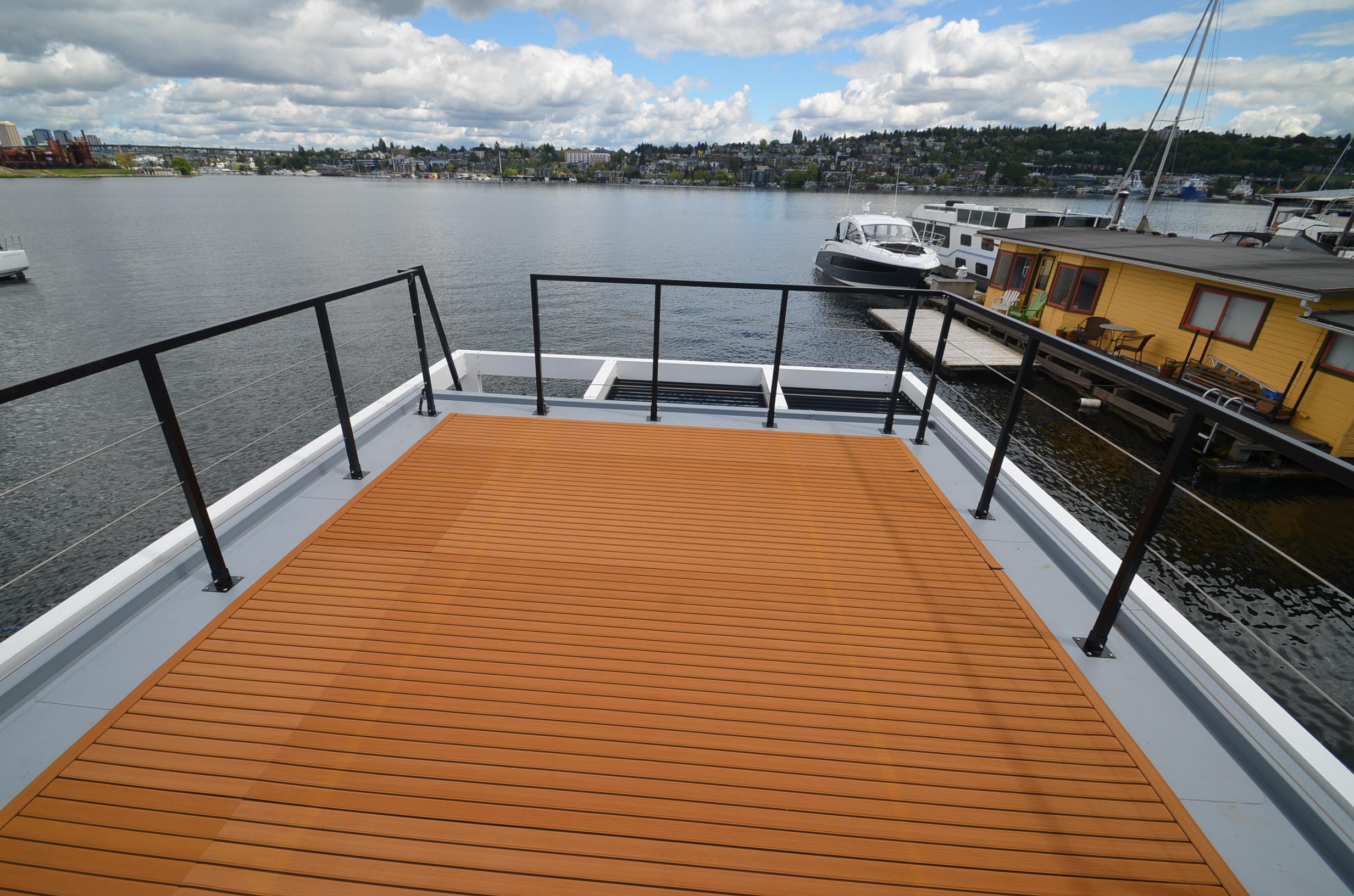 La Mare Modern 11 houseboat deck overlooking serene lake, 2024 model.