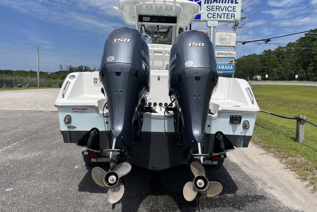 2021 Sea Hunt Gamefish 25 with twin Yamaha 150 engines at marine service center.