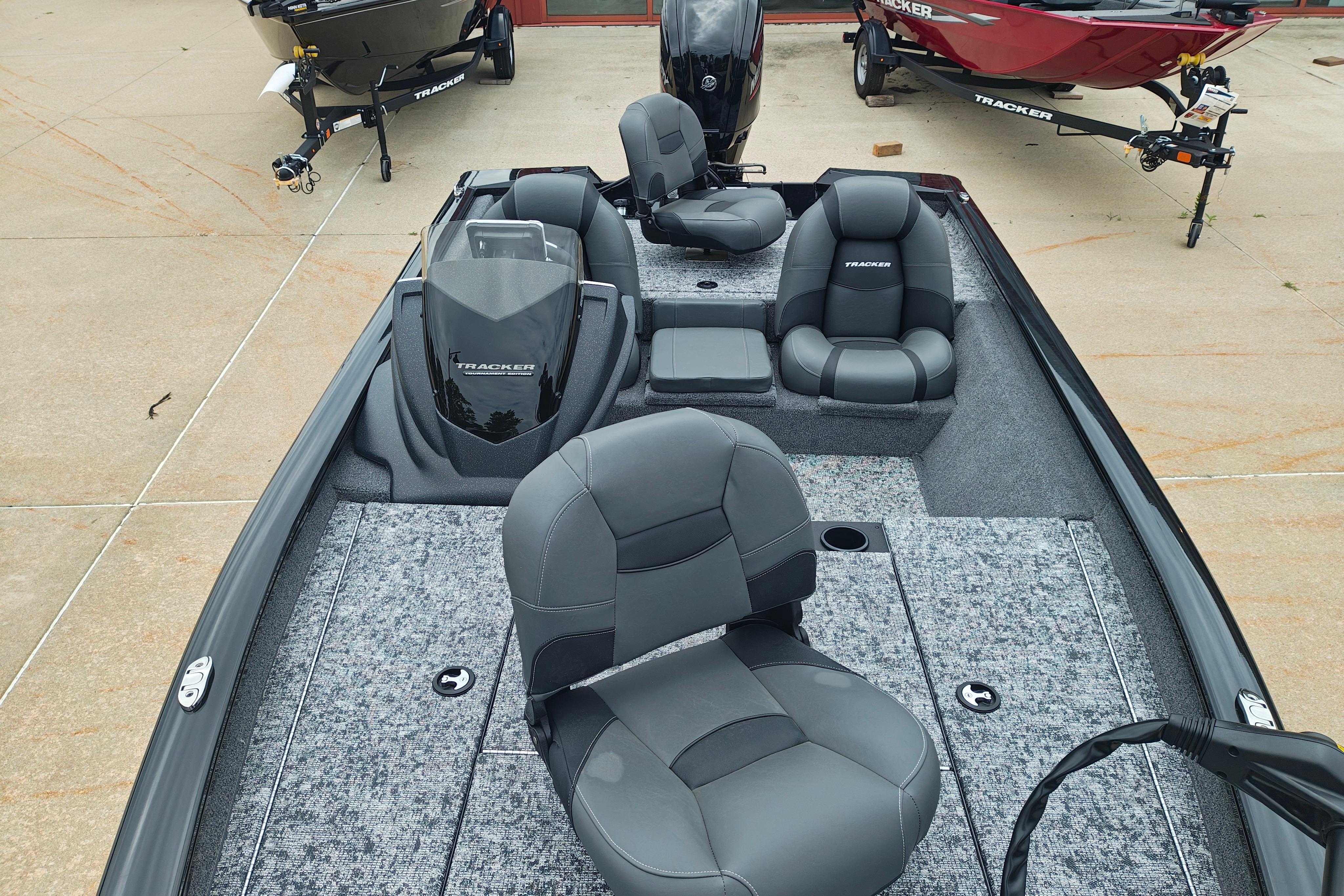 2026 Tracker Pro Team 175 boat interior with gray seating and carpeted flooring.