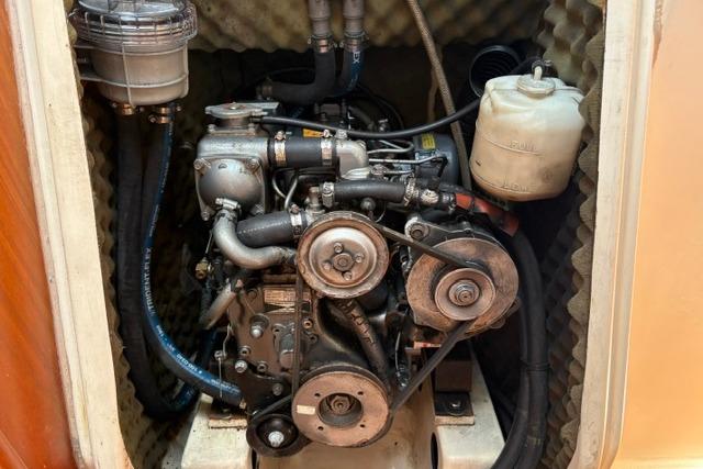 Engine compartment of a 2000 Beneteau Oceanis 321 sailboat, showcasing mechanical components.