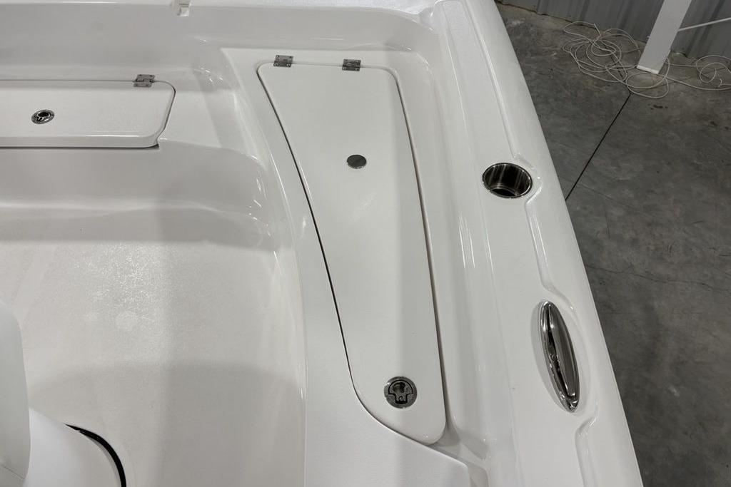2026 Tidewater 2210 Carolina Bay boat deck with storage compartments and cup holder.