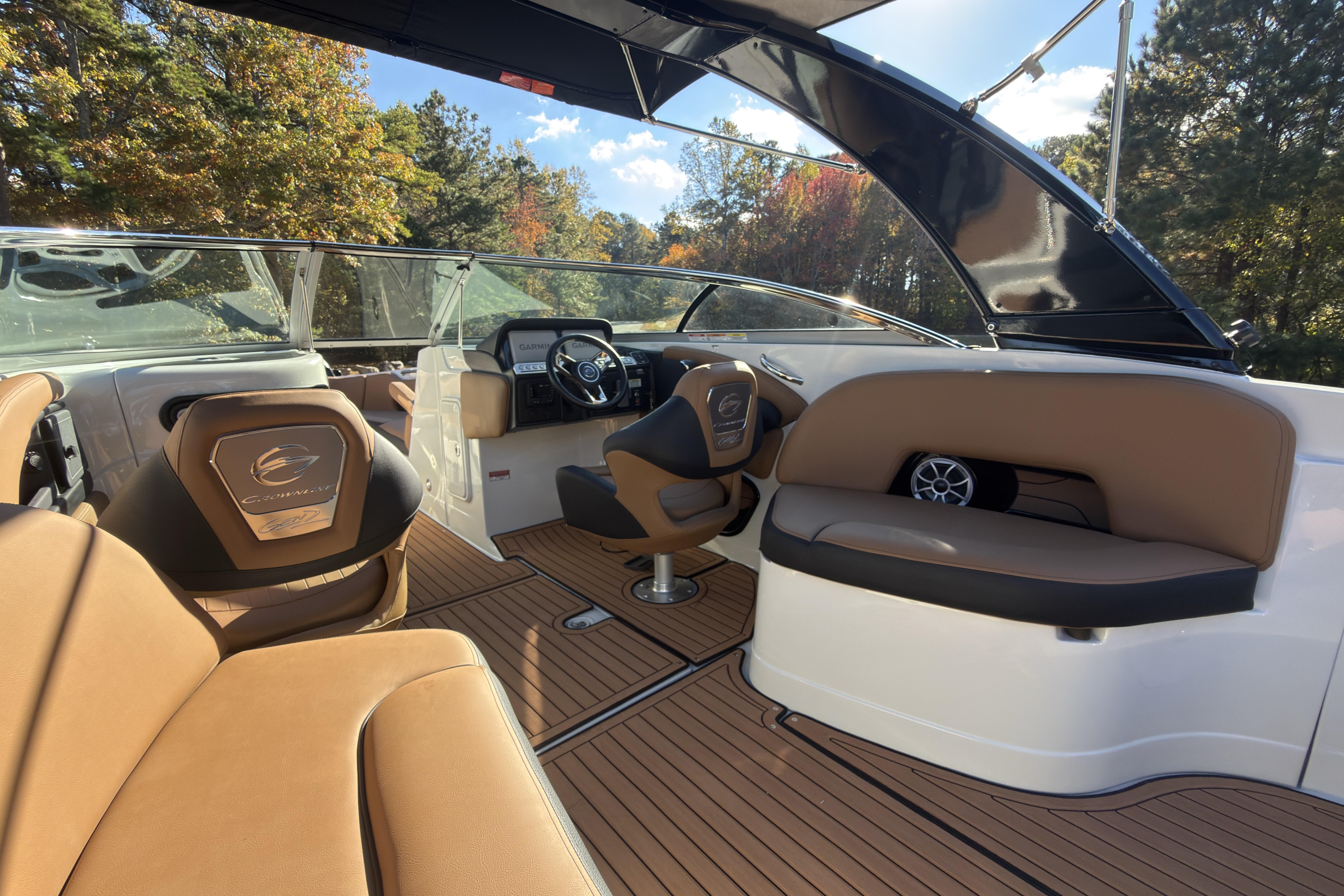 2026 Crownline 298 SS boat interior with luxurious seating and modern dashboard.